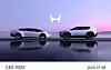Two Honda 0 Series electric concept cars side by side at sunset with Honda logo above.