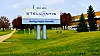 Stellantis Sterling Heights Assembly Plant sign on a grassy lawn outside the factory buildings.