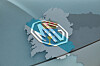 MG logo over a stylised map of Galicia in blue and grey.