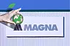 A Magna logo on a white sign, with a hand holding a small green globe icon in the foreground.