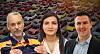 Three people pose in front of a background of many parked cars.