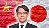 Portrait of a suited man overlaid on the Japanese and Chinese flags.