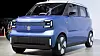 A blue Suzuki compact electric car shown front on in an indoor display area.