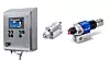 A metal control cabinet sits beside two industrial spray components on a white background.