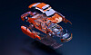 Exploded 3D view of an electric vehicle with separated body panels, battery pack and drivetrain components.