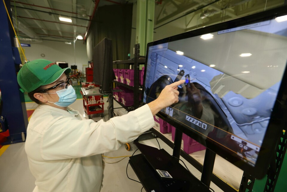An associate perfects her assembly techniques for 2022 Acura MDX using the new virtual training software Virtual reality training system at Honda East Liberty Auto plant