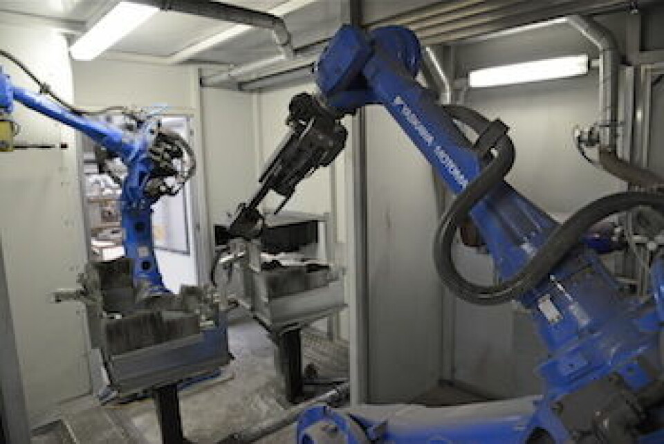Cobot companions Yaskawa robots carrying out component loading/unloading and machining operations.