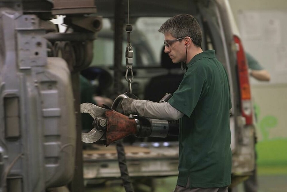 A Renault worker dismantles components from an end-of-life vehicle to clean and recondition those suitable for reuse - the principle of the circular economy. Renault dismantling Flins