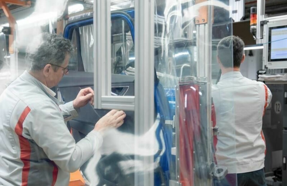 Returning to the line after the coronavirus shutdowns, Audi assembly workers are getting used to new protective plastic screening at the stations where distancing is more difficult Plastic screens keeping Audi workers safe